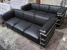 2 · 2 X MATCHING 3-SEAT LOUNGE CHAIRS. BLACK LEATHER WITH POLISHED STEEL FRAME.