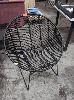 17 · RATTAN PATIO CHAIR, STEEL FRAME IN BLACK.