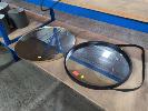 71 · 2 X ROUND WALL MIRRORS. ONE 710 MM DIAMETER WITH LEATHER HANGING STRAP RIM IN BLACK. ONE 800 MM DIAMETER WITH SATIN BRONZE METALLIC RIM.