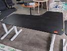 143 · ELECTRIC HEIGHT ADJUSTABLE CORNER DESK (IKEA BEKANT). LHS RETURN. BLACK WOODGRAIN LAMINATE TOP, WHITE LEGS. 1,600 X 1,000 MM OVERALL.