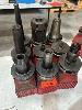 130 · 9 x BT50 TOOL HOLDERS WITH ASSORTED TOOLING INCLUDING PLASTIC STANDS