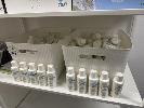 2 x PLASTIC BASKETS OF BOTTLES, CLEAR SKINCARE POST LASER GEL, 100ml