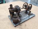 Stirling Engine, Working Engineering Model. Alpha Type With Burner. 260 X 150 X 150 Mm (W D H Approx). With Mirror Backed Display Box. No Gst
