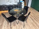 OCCASIONAL SUITE, 5 PIECE CIRCULAR GLASS TOPPED TABLE & 4 x LEATHER LOOK CHAIRS