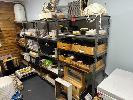 BEEKEEPING CONTENTS INCLUDING, HIVE SECTIONS, SUITS, JARS, APPLICATORS, SIEVES PLUS, CONTENTS OF FREEZERS (NOT FREEZERS), HESSIAN BAGS, 7 x MODULAR RACKS & TROLLEY