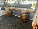 4 · LIVE EDGE SOLID TIMBER BAR TOP, CLEAR STAIN,2900 x 950mm (H) ON 2 x WINE BARRELS,