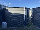 10 · TANK 10, PIONEER WATER TANKS COLORBOND CORRUGATED SLATE GREY WATER TANK, APPROXIMATELY 25,000 LITRE CAPACITY, APPROXIMATE SIZE 1.7 METRE HIGH x 74.2 METRE DIAMETER, WITH ACCESS LADDER, & BIANCO ELECTRIC PUMP, MOD: BIAINOX45S2NXT,, 240 VOLT SINGLE PHASE