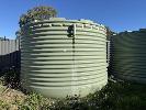 14 · TANK 14, POLY WATER TANK OLIVE GREEN, APPROXIMATELY 30,000 LITRE CAPACITY, APPROXIMATE SIZE 2.3 METRE HIGH x 4 METRE DIAMETER, WITH LOWRA ELECTRIC PUMP, MOD: 5HM06S07M5HVBE, 240 VOLT SINGLE PHASE