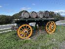 20 · VINTAGE TIMBER 4 WHEEL HORSE DRAWN TRAILER, APPROXIMATELY 4450 (L) x 2460mm (W), WITH 4 x RUSTIC TIMBER WINE BARRELS
