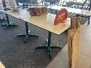24 · PAIR OF CAFE TABLES, WHITE TOP, BLACK EDGE, GREEN STEEL PEDESTAL BASE, 800 x 800 x 735mm (H)