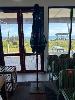 145 · PIRATE LIFE CAFE UMBRELLA, WITH STAND, NEEDS REPAIR