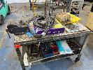 30 · MOBILE BENCH, 1200 x 600mm, WITH 100mm RECORD VICE, ASSORTED SPARE PARTS, TIG & MIG FEEDS, SAW BLADE, ETC
